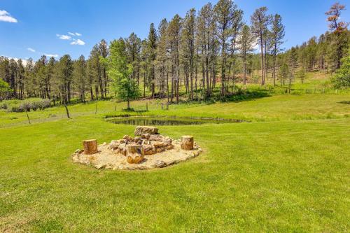 a sand castle in the middle of a field at Remote Custer Cabin with Fire Pit and Near State Park! in Custer