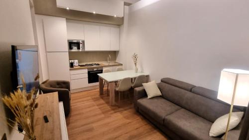 a living room with a couch and a table at La Ginestra C&B House and Rooms in Castel di Sangro