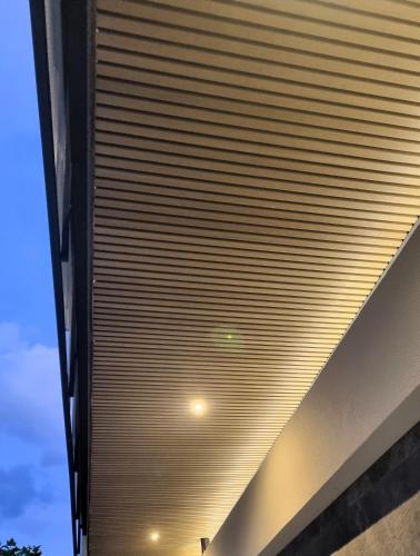 a wooden roof on the side of a building at La Ginestra C&B House and Rooms in Castel di Sangro