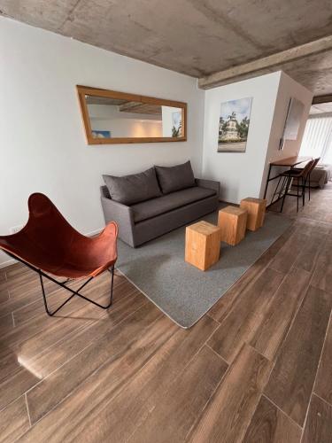 a living room with a couch and a table at De lo mejor en Barrio General Paz in Cordoba