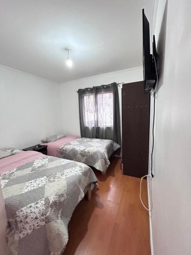 Ένα ή περισσότερα κρεβάτια σε δωμάτιο στο Hostal la Plaza