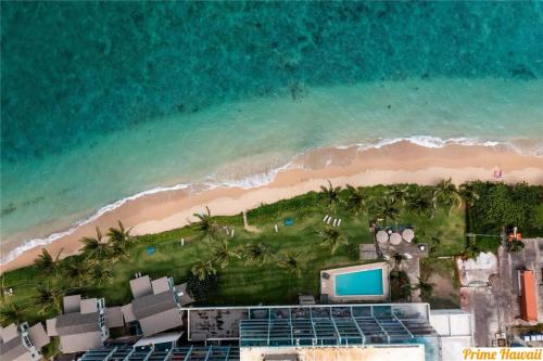 an aerial view of the beach and the ocean at NEW Beachfront Condo in Hauula