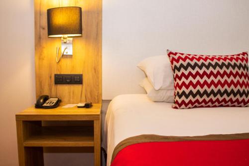 Voodi või voodid majutusasutuse Ramada by Wyndham Panama Via Argentina toas