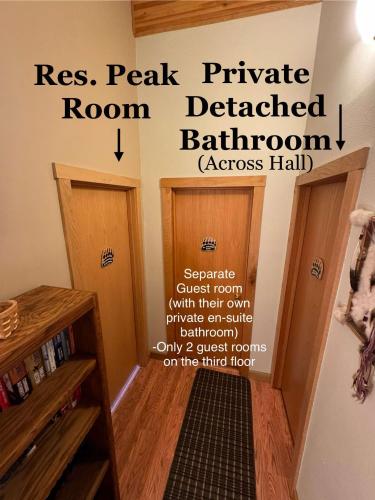 a room with two doors and a sign on the wall at Bear Lake Lodgings B&B, Inc in Seward