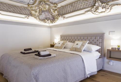 Postel nebo postele na pokoji v ubytování CASA LE 4 ARTI - 86Mq in Via Lagrange 43 LUXURY
