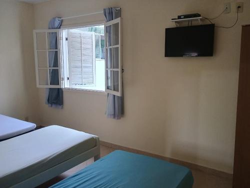 Ένα ή περισσότερα κρεβάτια σε δωμάτιο στο Apartamento 2 quartos em Conservatória - até 9 pessoas!