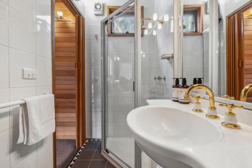 a bathroom with a sink and a shower at Nowhere Chalet in Crackenback