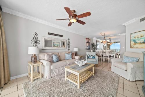 a living room with a couch and a ceiling fan at Bluewater Unit 404 in Orange Beach