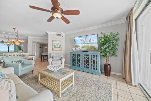 a living room with a couch and a ceiling fan at Bluewater Unit 404 in Orange Beach