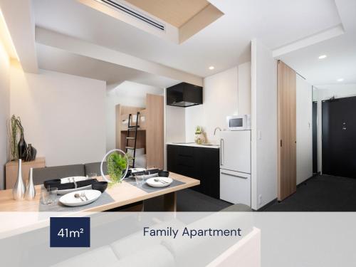 an apartment with a kitchen and a living room at MIMARU Osaka Namba North in Osaka