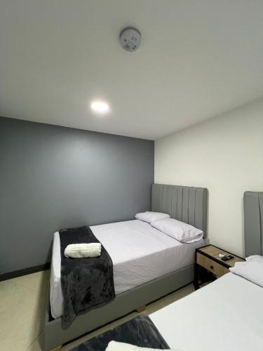 Ένα ή περισσότερα κρεβάτια σε δωμάτιο στο Hotel Casa Florida 70 Medellin