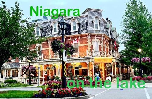 a building with a sign that reads nagiara in front of it at Barkerhouse 2# unit-heart of oldtown in Niagara on the Lake