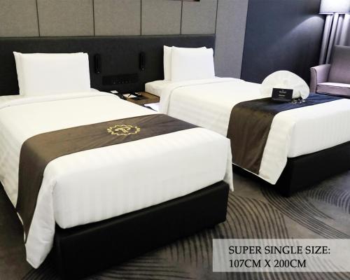 Кровать или кровати в номере The Pearl Kuala Lumpur