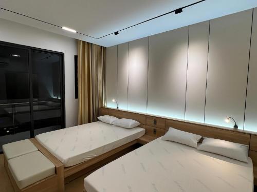 Postel nebo postele na pokoji v ubytování C&M Hotel