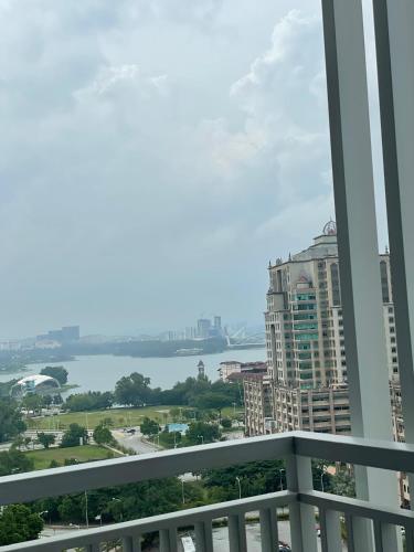 a view of the water from the balcony of a building at HARRAZ SUITE PUTRAJAYA just minutes away from PICC and KPT perfect for both business and leisure stays in Putrajaya