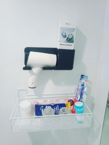 a paper towel dispenser on a shelf in a refrigerator at Studio Seaview Jomtien floor12 23sqm in Jomtien Beach