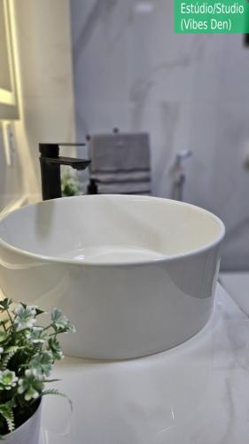 a white sink on a counter in a bathroom at Copacabana Vibes Studios in Rio de Janeiro
