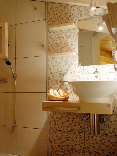a bathroom with a sink and a mirror at Grimani Pension in Nafplio