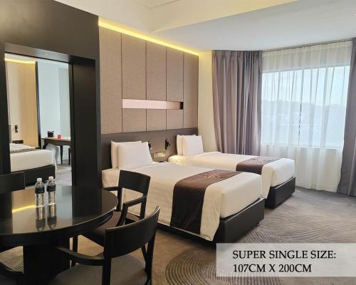 Кровать или кровати в номере The Pearl Kuala Lumpur