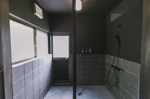Koupelna v ubytování SAUNA&STAY MUNI 桜島