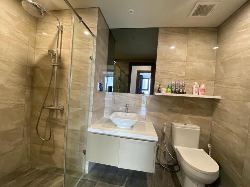 a bathroom with a toilet and a sink and a shower at The Matrix One Căn Hộ 3 Phòng Ngủ Tiện Nghi. in Hanoi