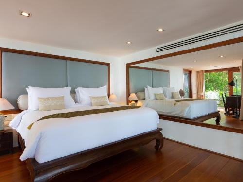Ένα ή περισσότερα κρεβάτια σε δωμάτιο στο Villa Riva