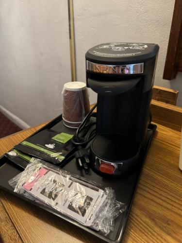 a coffee maker sitting on top of a table at Town House Motel in San Francisco
