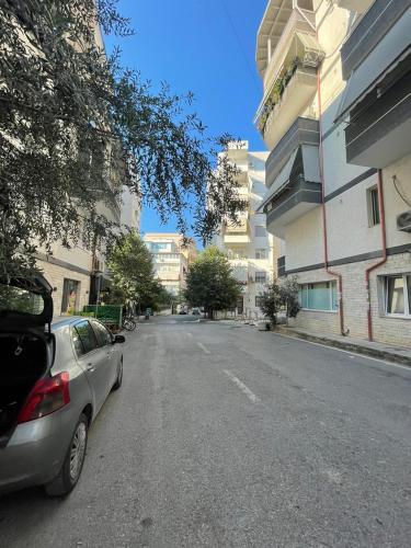 a car parked on the side of a city street at Tirana Perla in Sauk