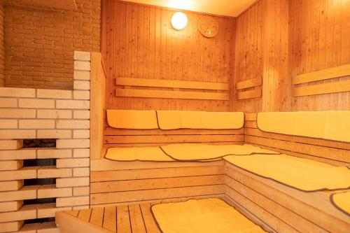 a sauna with three beds in a room at Hill Hotel Sunpia Iga in Iga