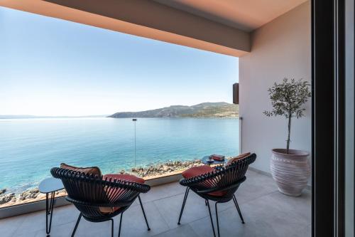 a room with a view of the ocean at Hotel Liakoto in Kardamili