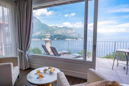a living room with a large window with a view of the ocean at Borgo Le Terrazze in Bellagio