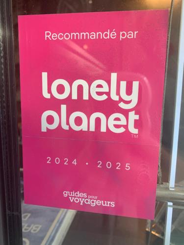 a pink sign in the window of a store at Ambassadeur Hotel - Cherbourg Port de Plaisance in Cherbourg en Cotentin