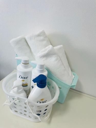 a basket with toiletries and towels on a counter at ソフィアハウス横浜 -女性専用シェアハウス- Sopfia House Yokohama for Women only shared house in Yokohama