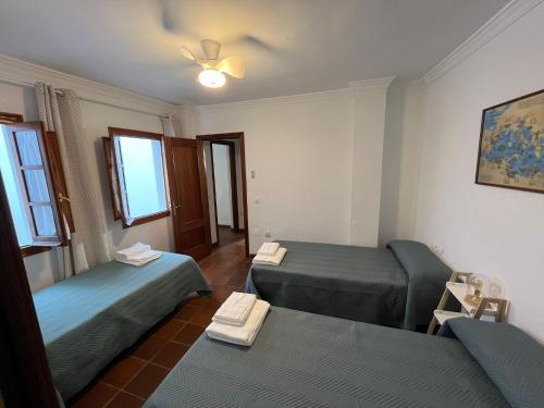 En eller flere senge i et værelse på Casa Lucero