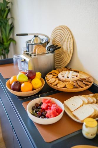 a table with plates of different types of food on it at Letizia B&B in Crotone