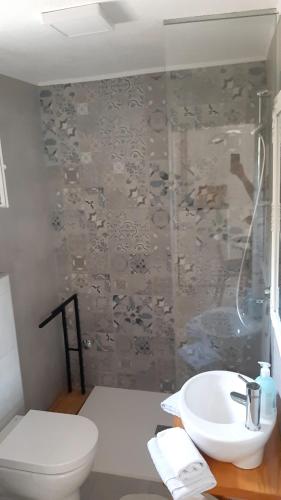 a bathroom with a toilet and a sink at Ravne Rest House in Visoko