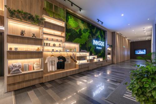 a fashion store with a large display of shirts on display at INNSiDE by Meliá Kuala Lumpur in Kuala Lumpur