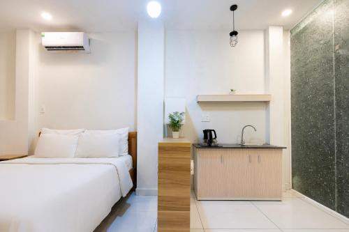 a bedroom with a bed and a shower at Gemini Saigon CENTER - New & Quiet near Bui Vien Walking Street in Ho Chi Minh City
