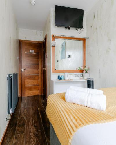 Postelja oz. postelje v sobi nastanitve ND Hotel