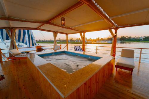 a hot tub on the deck of a boat at Turquoise Dahabiya , 3,4,7 nights sailing between Luxor and Aswan in Luxor