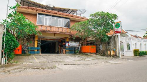 a building on the side of a street at Hotel Horton by My Hospitality in Cirebon