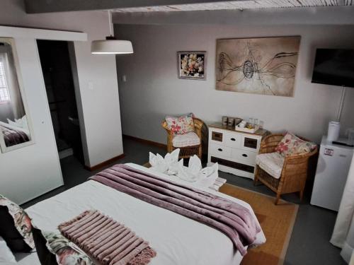 Ένα ή περισσότερα κρεβάτια σε δωμάτιο στο Grace Walk Guest House