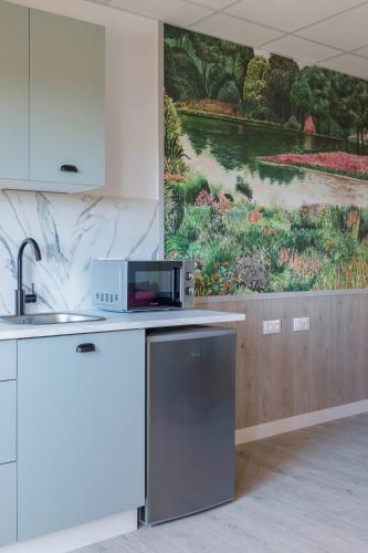 Luxury Singular Apartments Orangeにあるキッチンまたは簡易キッチン