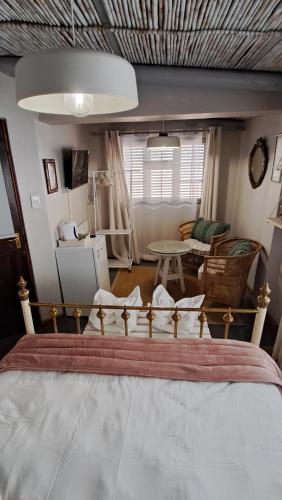Ένα ή περισσότερα κρεβάτια σε δωμάτιο στο Grace Walk Guest House