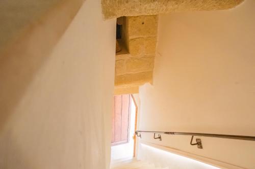 a view of a room with a window at HISTORIA- Dimore Vico Ghezzi in Carpignano Salentino