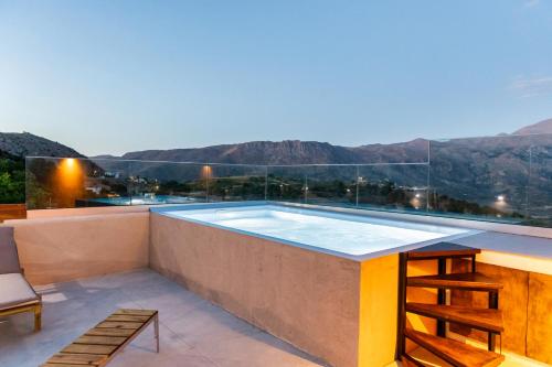 a swimming pool on the roof of a house at Luxury apartment with rooftop pool in Meronas in Méronas
