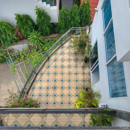 an overhead view of a staircase in a building with plants at Celebrity Ocean View Villa Samui in Bang Rak Beach