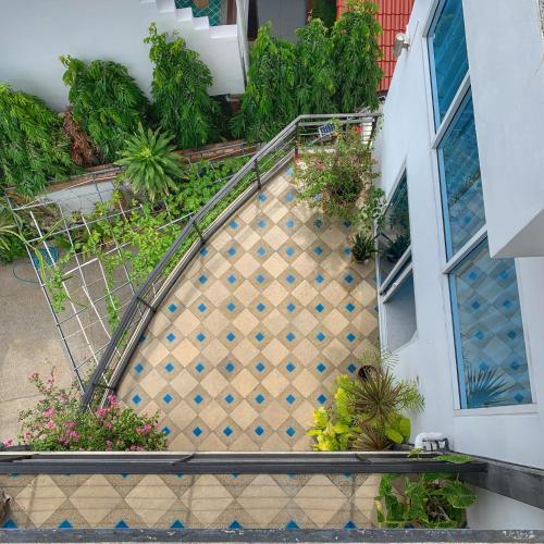 an overhead view of a staircase in a building with plants at Celebrity Ocean View Villa Samui in Bang Rak Beach