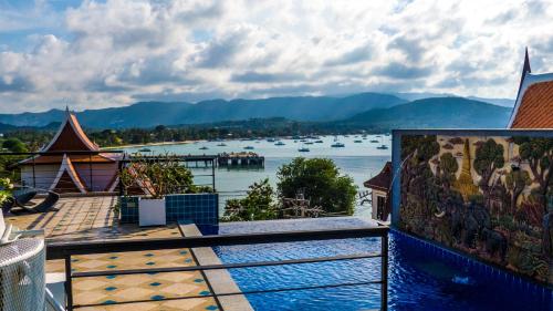 a balcony with a view of a body of water at Celebrity Ocean View Villa Samui in Bang Rak Beach