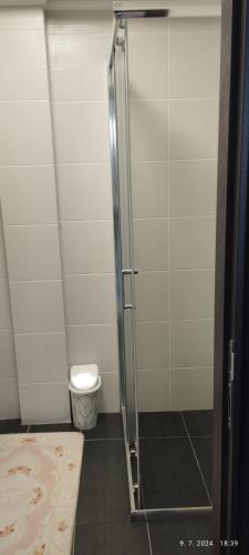 a shower stall in a bathroom with a toilet at CENTAR CEPERKOVIC in Vrnjačka Banja